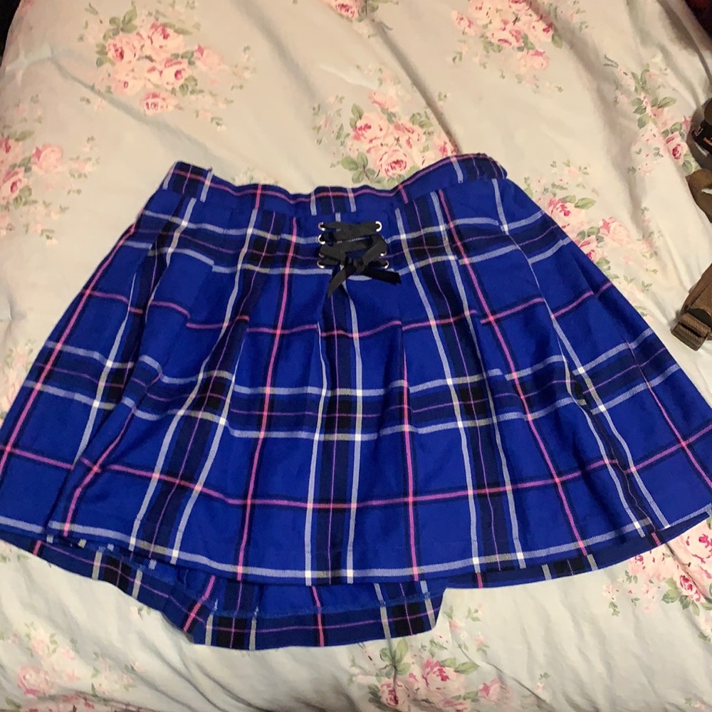 This is a plaid, vibrant colored skirt with built in shorts.